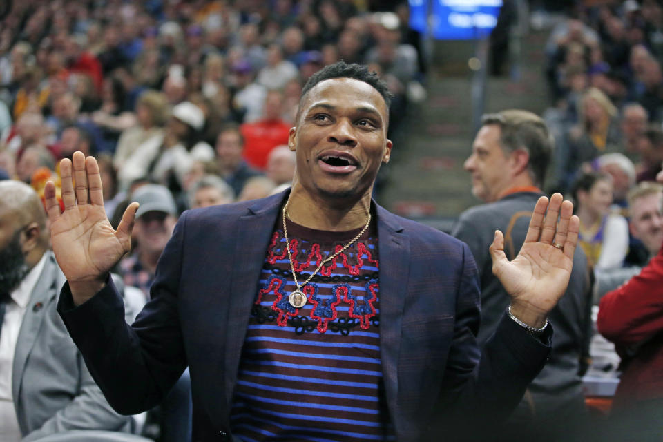 Houston Rockets guard Russell Westbrook reacts as he sits on the bench in the first half during an NBA basketball game against the Utah Jazz Monday, Jan. 27, 2020, in Salt Lake City. (AP Photo/Rick Bowmer)