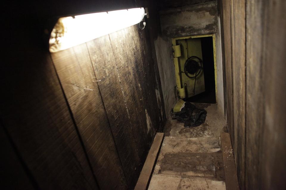 An open steel door leads from a tunnel underneath one of the houses of Joaquin "Chapo" Guzman to the city's drainage system in Culiacan