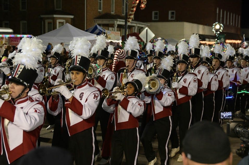 High school bands participate in the Christmas in Ida Festival. Here, the Monroe High School Band marches in 2019.