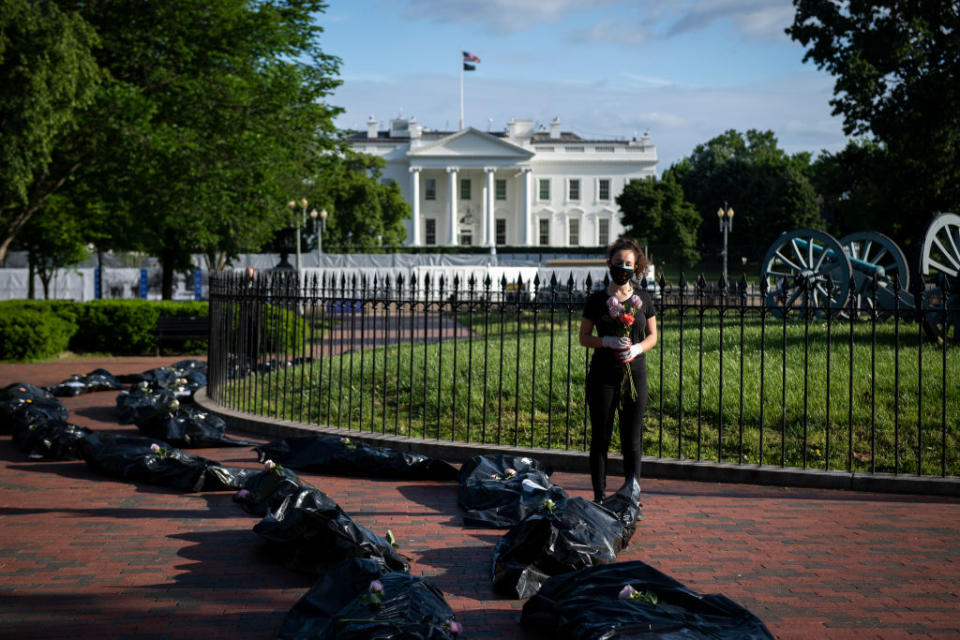 Demonstrators display fake body bags in protest of the Trump administration's response to the coronavirus pandemic. Source: Getty