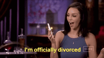 Woman holding up her cellphone and saying "I'm officially divorced"