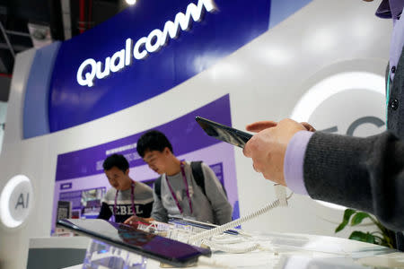 FILE PHOTO: A Qualcomm sign is seen during the China International Import Expo (CIIE), at the National Exhibition and Convention Center in Shanghai, China November 7, 2018. REUTERS/Aly Song/File Photo