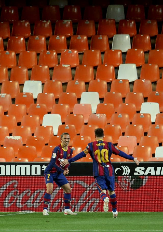 Barcelona’s Antoine Griezmann celebrates his goal with Lionel Messi 