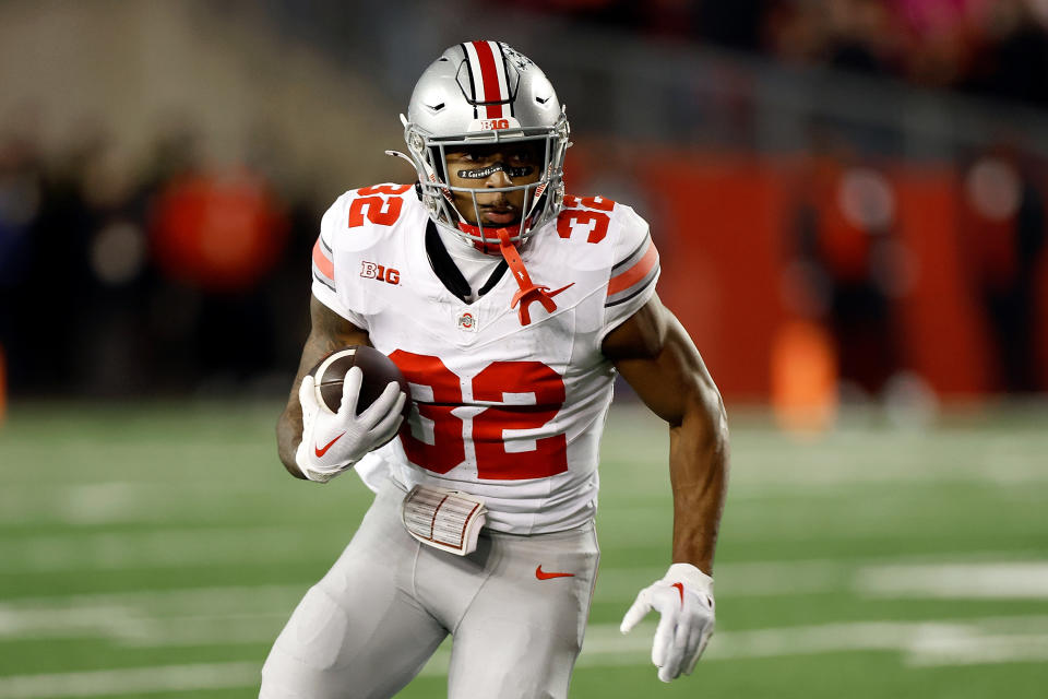 MADISON, WISCONSIN – OCTOBER 28: TreVeyon Henderson #32 of the Ohio State Buckeyes rushes the ball during the first quarter against the Wisconsin Badgers at Camp Randall Stadium on October 28, 2023 in Madison, Wisconsin. (Photo by John Fisher/Getty Images)