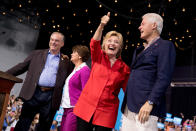 <p>Democratic presidential candidate Hillary Clinton, second from right, accompanied by Democratic vice presidential candidate, Sen. Tim Kaine, D-Va., left, Tim Kaine’s wife Anne Holton, second from left, and former President Bill Clinton, right, gives a thumbs up to supporters as they arrive at a rally at David L. Lawrence Convention in Pittsburgh, July 30, 2016. (Photo: Andrew Harnik/AP) </p>