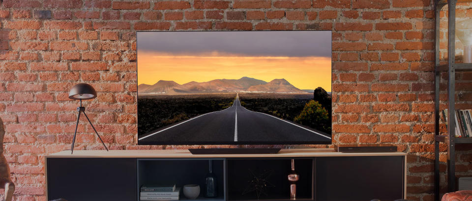 An LG OLED big screen TV displayed in a living room.