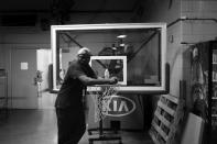 <p>Rasheed Stewart, a member of the union that built the venue, rests on a basketball hoop during a slow period during the DNC Convention if Philadelphia, PA. on July 25, 2016. (Photo: Khue Bui for Yahoo News)</p>