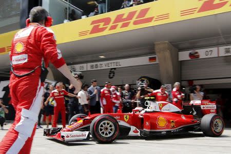 Formula One - Chinese F1 Grand Prix - Shanghai, China - 17/4/16 - Ferrari driver Kimi Raikkonen of Finland pulls out of his team's garage before the Chinese Grand Prix. REUTERS/Pool