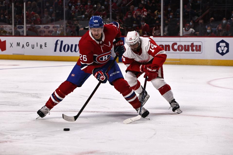 Montreal Canadiens defenseman Jeff Petry (26) plays the puck against Detroit Red Wings center Robby Fabbri (14) during the second period at Bell Centre, Oct. 23, 2021