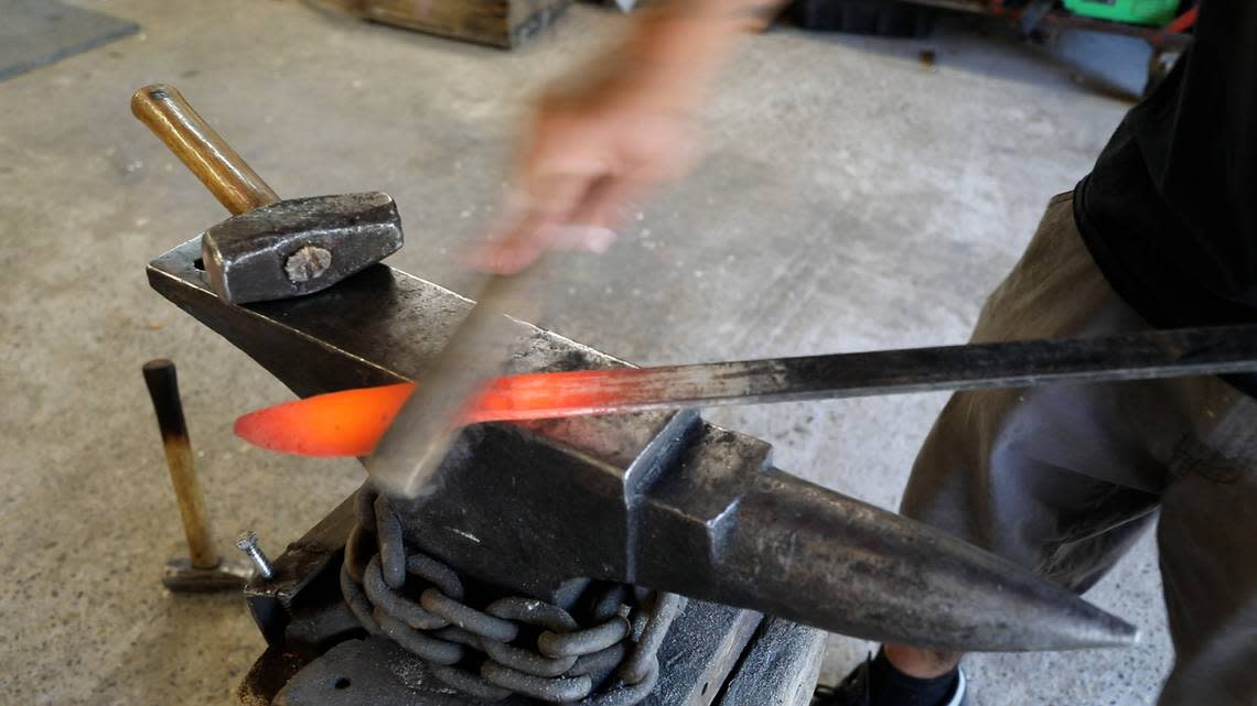 Emilio Carbajal forges steel to create a new knife blade.