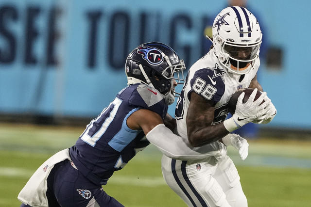 Dallas Cowboys wide receiver CeeDee Lamb (88) is seen with red, white and  blue strips on his helmet in honor of Salute to Service during warms up  before an NFL football game