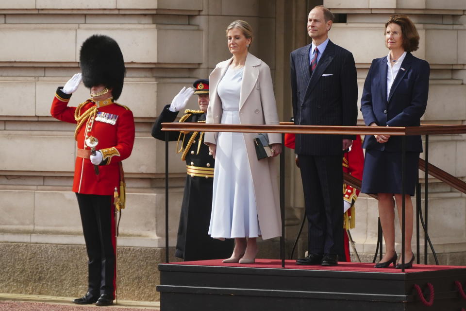 Britain's Prince Edward and Sophie, the Duke and Duchess of Edinburgh, on behalf of King Charles III, with French Ambassador to the UK, Helene Duchene, watch as troops from France's 1er Regiment de le Garde Republicaine partake in the Changing of the Guard ceremony at Buckingham Palace, to commemorate the 120th anniversary of the Entente Cordiale - the historic diplomatic agreement between Britain and France which laid the groundwork for their collaboration in both world wars, in London, Monday, April 8, 2024. France is the first non-Commonwealth country to take part in the Changing of the Guard. (Victoria Jones/Pool Photo via AP)