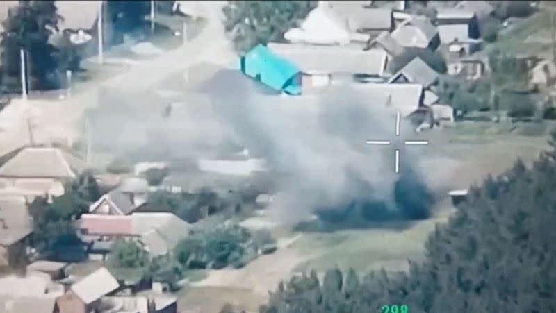 FILE PHOTO: A still image from a drone footage released by Freedom of Russia Legion shows what they claim is a destruction of Russian military targets near Novaya Tavolzhanka