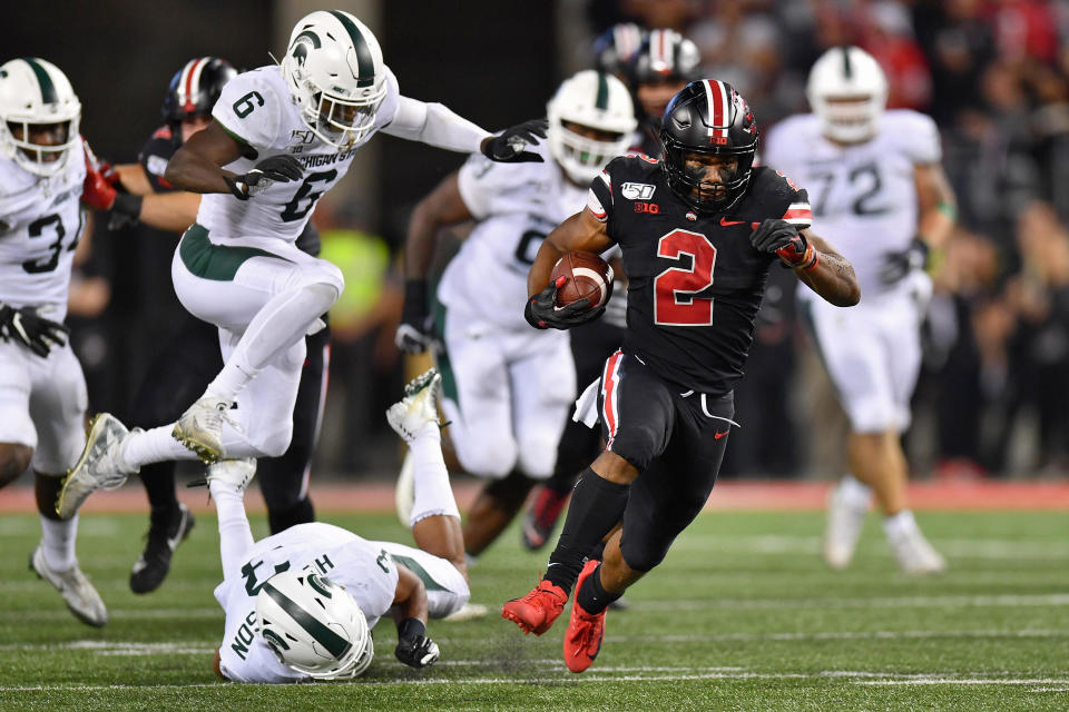 CJ.K. Dobbins #2 of the Ohio State Buckeyes takes off on a 67-yard touchdown run in the second quarter of his team's win over the Michigan State Spartans. (Getty)