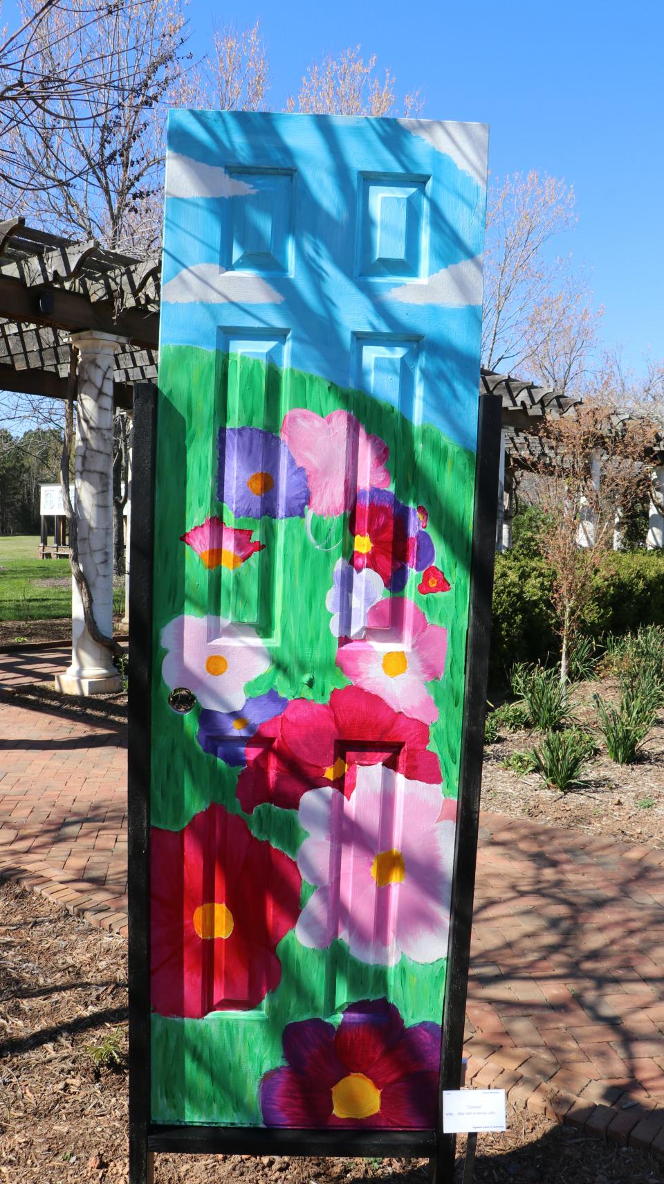 More than 70 Highland School of Technology students participated in a project where they painted doors, which are now on display at Daniel Stowe Botanical Garden.