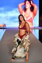 <p>Paralympian snowboarder Brenna Huckaby walks the runway for the swimsuit show during the Paraiso Fashion Fair in Miami at the W South Beach hotel on July 15. (Photo: Alexander Tamargo/Getty Images for Sports Illustrated) </p>