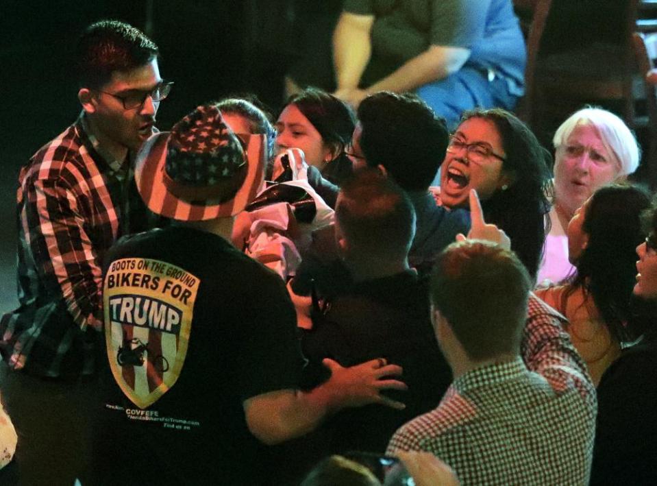 Campaign workers and supporters physically remove protesters from a campaign rally for a Florida candidate endorsed by Donald Trump.