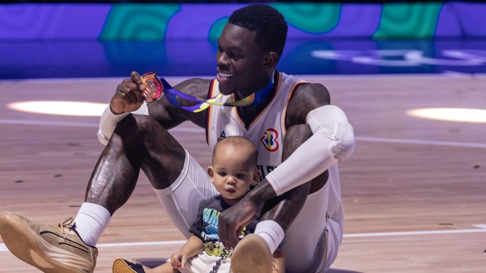 MALL OF ASIA ARENA, MANILA, PHILIPPINES - 2023/09/10: Dennis Schroder of Germany celebrates with his son after winning the finals of the FIBA Basketball World Cup 2023 between Serbia and Germany at the Mall of Asia Arena-Manila. Final score: Germany 83:77 Serbia. (Photo by Nicholas Muller/SOPA Images/LightRocket via Getty Images)