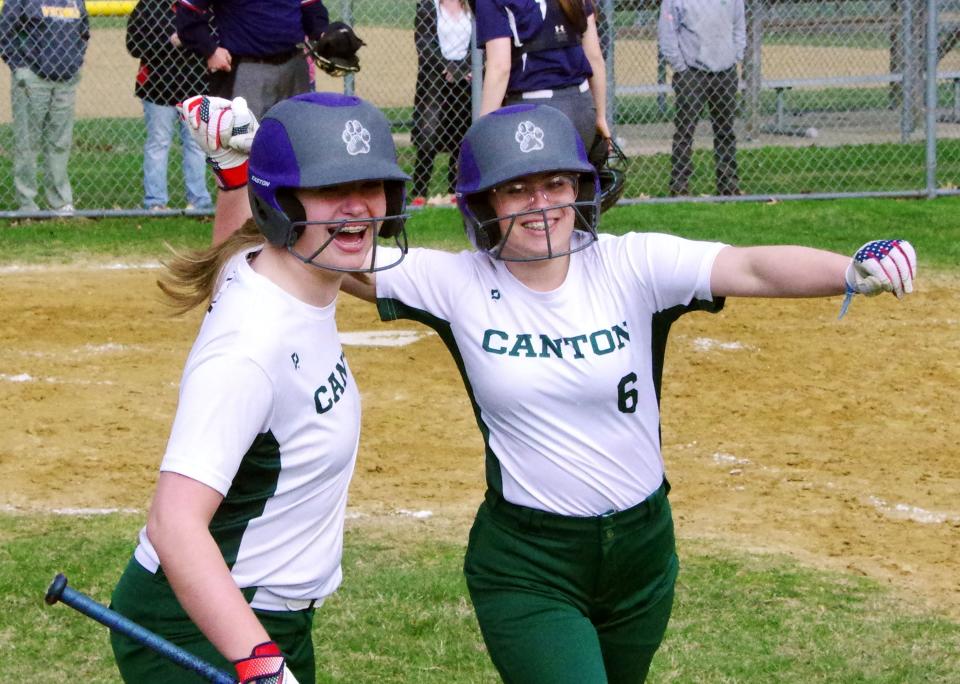 Canton's Caitlin Reynolds and Natalia Tolliver celebrate another run as Canton continued to put pressure on Rockland on Thursday, April 6, 2023.