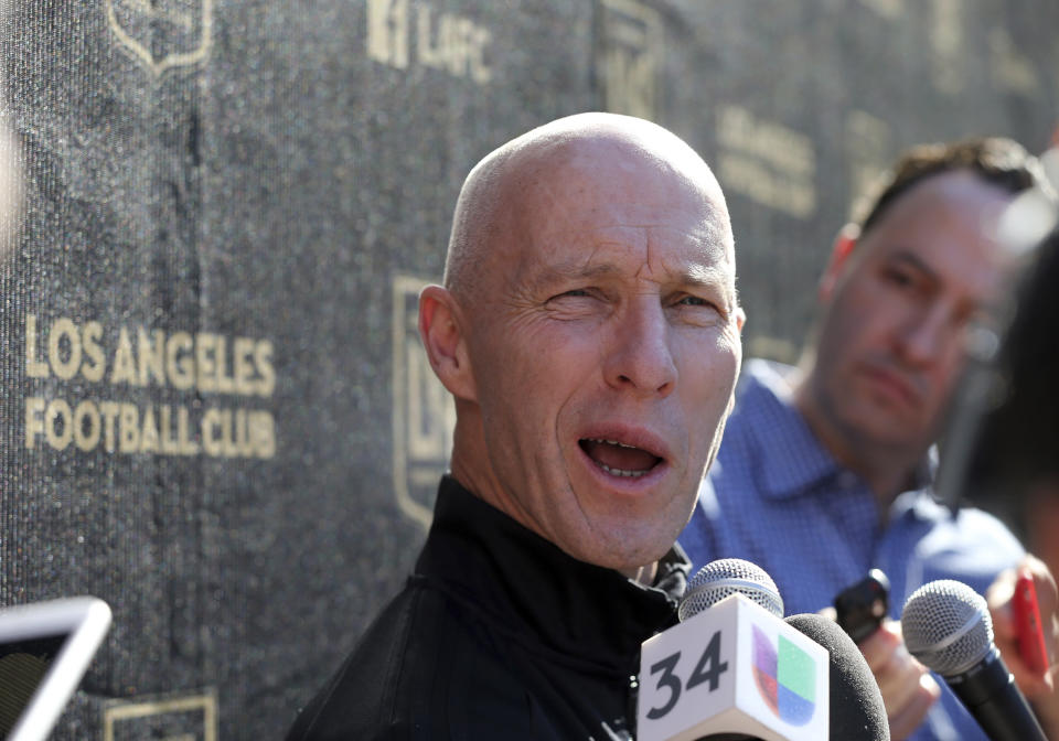 Head coach Bob Bradley talks with reporters during the introduction of players and coaches at the first training camp of the Los Angeles Football Club MLS soccer team on the campus of UCLA in Los Angeles, Monday, Jan. 22, 2018. (AP Photo/Reed Saxon)