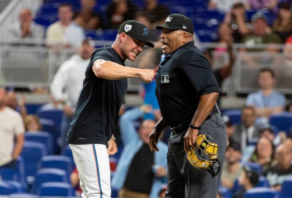 Miami Marlins manager Skip Schumaker (45) argues with umpire Laz Diaz (63) in the eighth inning of his MLB game against the San Francisco Giants at loanDepot park on Monday, April 15, 2024, in Miami, Fla.