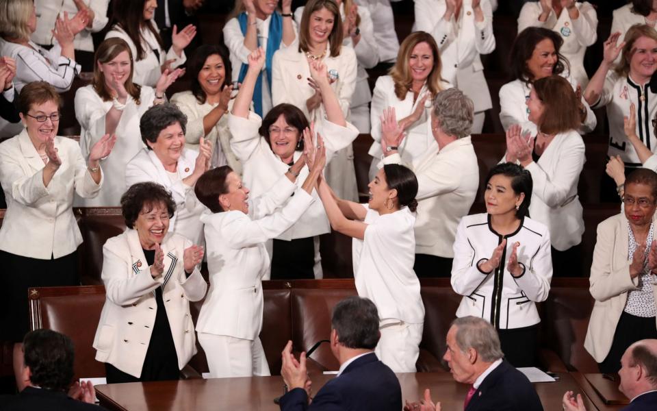 Democratic female members of Congress wear white to celebrate there being more female members than ever - JONATHAN ERNST /REUTERS