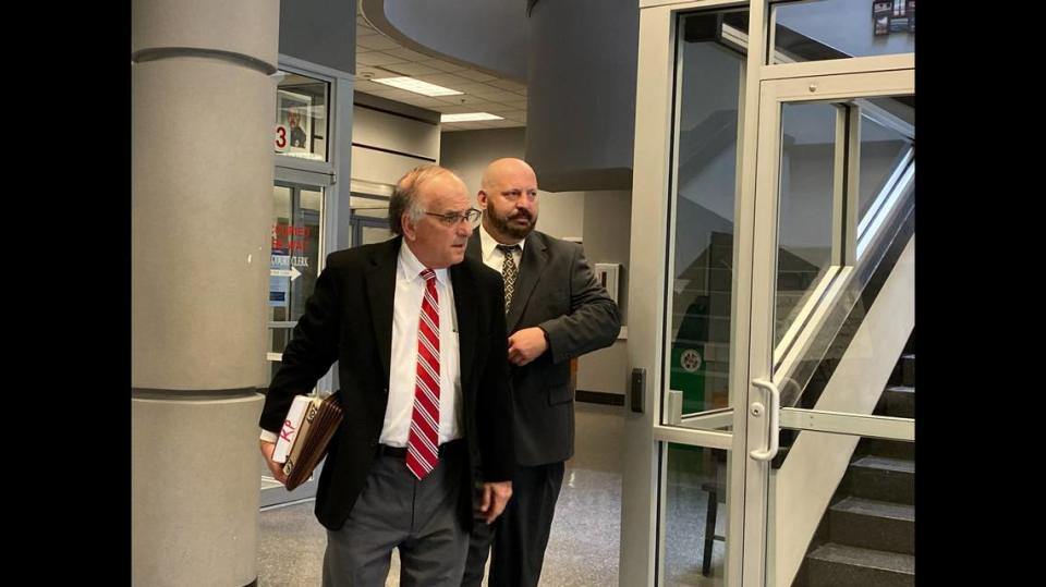 Attorney Keith Pisarich, left, and Gautier police Officer Friedrich “Fred” Carl Paetow heading to Biloxi city court, where Paetow if found guilty of a misdemeanor crime