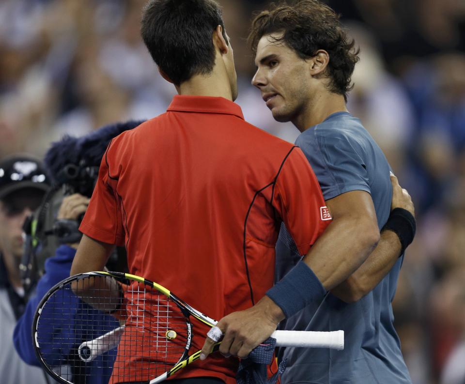 Nadal of Spain is congratulated by Djokovic of Serbia after his victory in their men's final match at the U.S. Open tennis championships in New York