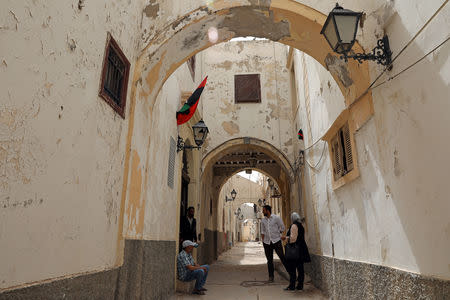 Libyans are seen in the old city of Tripoli, Libya April 23, 2019. Picture taken April 23, 2019. REUTERS/Ahmed Jadallah