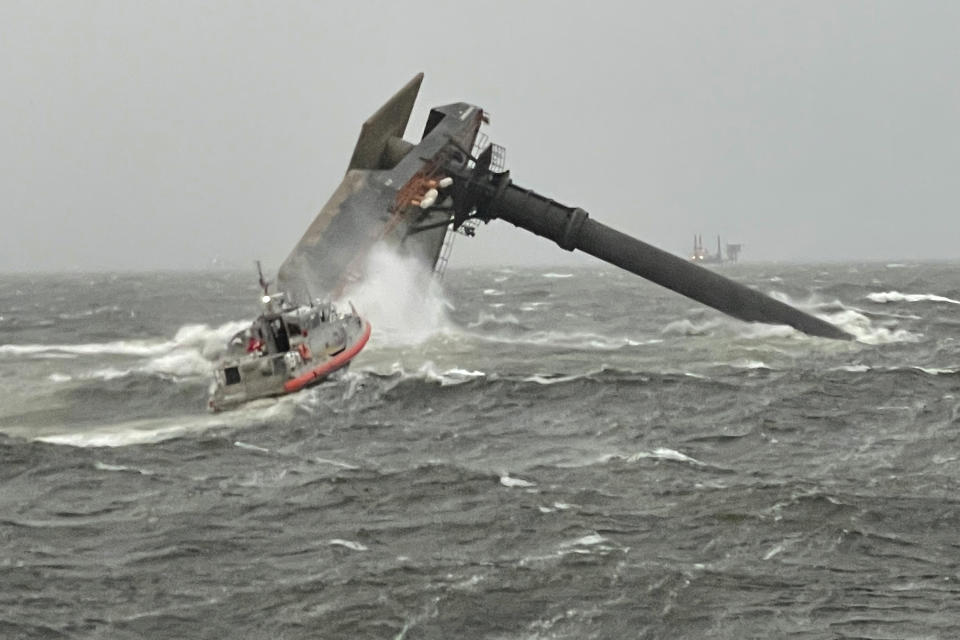 A Coast Guard Station Grand Isle 45-foot Respone Boat-Medium boatcrew heads toward a capsized 175-foot commercial lift boat Tuesday, April 13, 2021, searching for people in the water 8 miles south of Grand Isle, Louisiana. The Coast Guard and multiple other boats rescued six people onboard a commercial lift boat that capsized off the coast of Louisiana on Tuesday night and were searching for more, the agency said.(U.S. Coast Guard Coast Guard Cutter Glenn Harris via AP)