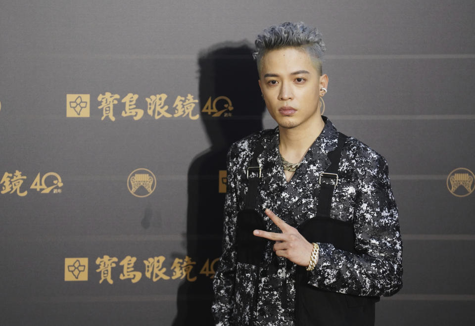 Taiwanese singer J.Sheon poses as he arrives for the 31th Golden Melody Awards in Taipei, Taiwan, Saturday, Oct. 3, 2020. The awards show, one of the world's biggest Chinese-language pop music annual events was postponed from June to Oct. due to the coronavirus pandemic. (AP Photo/Billy Dai)