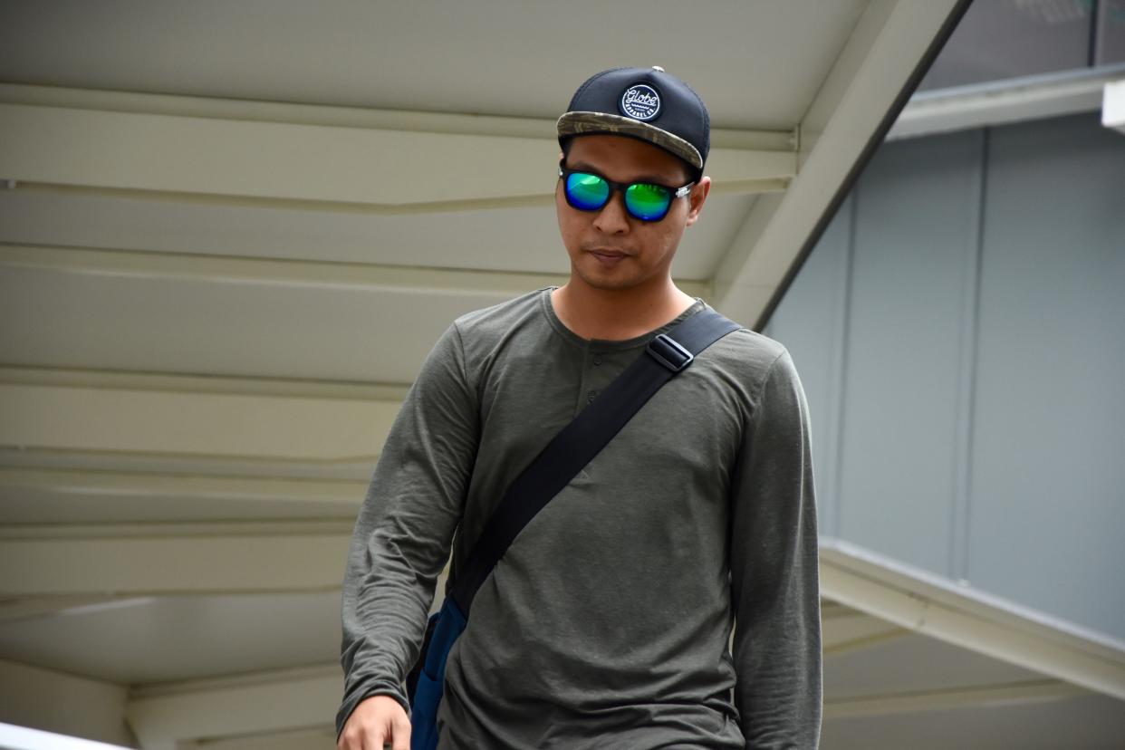 Adighazali leaving the State Courts on 25 July. (PHOTO: Suhaile MD / Yahoo News Singapore)