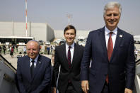 Israeli National Security Advisor Meir Ben-Shabbat, left, U.S. President Donald Trump's senior adviser Jared Kushner, center, and U.S. National Security Advisor Robert O'Brien, right, board the Israeli flag carrier El Al's airliner as they fly to Abu Dhabi for talks meant to put final touches on the normalization deal between the United Arab Emirates and Israel, at Ben-Gurion International Airport, near Tel Aviv, Israel Monday, Aug. 31, 2020. (Nir Elias/Pool Photo via AP)