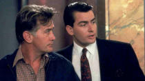 <p> In Oliver Stone’s <em>Wall Street</em>, Bud Fox (Charlie Sheen) becomes consumed by the wealth he initially acquires after being taken under the wing of his hero, Gordon Gekko (Academy Award winner Michael Douglas). However, when he learns his mentor is planning a deal that would ruin his own father's (Martin Sheen) company, Bud opts to turn against the ruthless Gordon, which ultimately puts them both behind bars. </p>