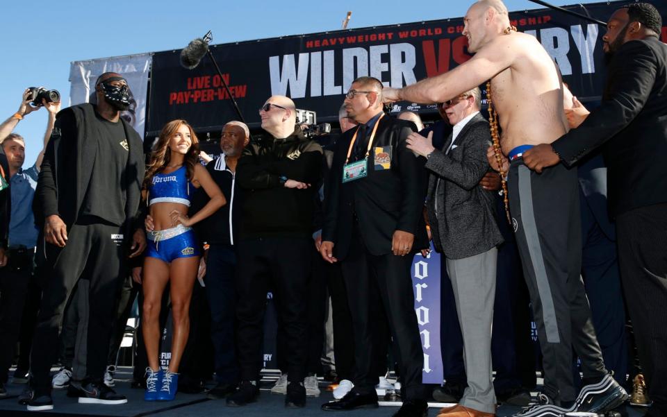 Verbals are exchanged at the Tyson Fury vs Deontay Wilder weigh-in - AP