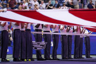 West Point cadets hold the American flag over the court at Arthur Ashe Stadium before the start of the women's single final between Ons Jabeur, of Tunisia, and Iga Swiatek, of Poland, at the U.S. Open tennis championships, Saturday, Sept. 10, 2022, in New York. (AP Photo/Charles Krupa)
