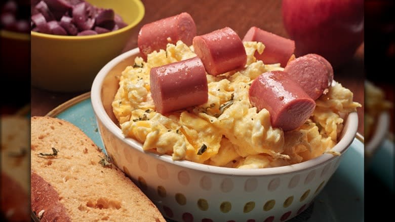 Bowl of scrambled eggs and hot dogs