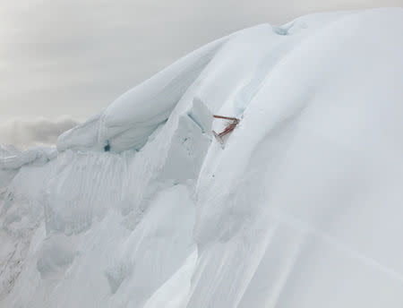 The wreckage of a sightseeing plane that crashed near the summit of one of the mountains in Denali National Park in this National Park Service image in Alaska, U.S., on August 6, 2018. Courtesy National Park Service/Handout via REUTERS