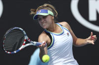 Sofia Kenin of the U.S. makes a forehand return to compatriot Ann Li during their second round singles match at the Australian Open tennis championship in Melbourne, Australia, Wednesday, Jan. 22, 2020. (AP Photo/Dita Alangkara)