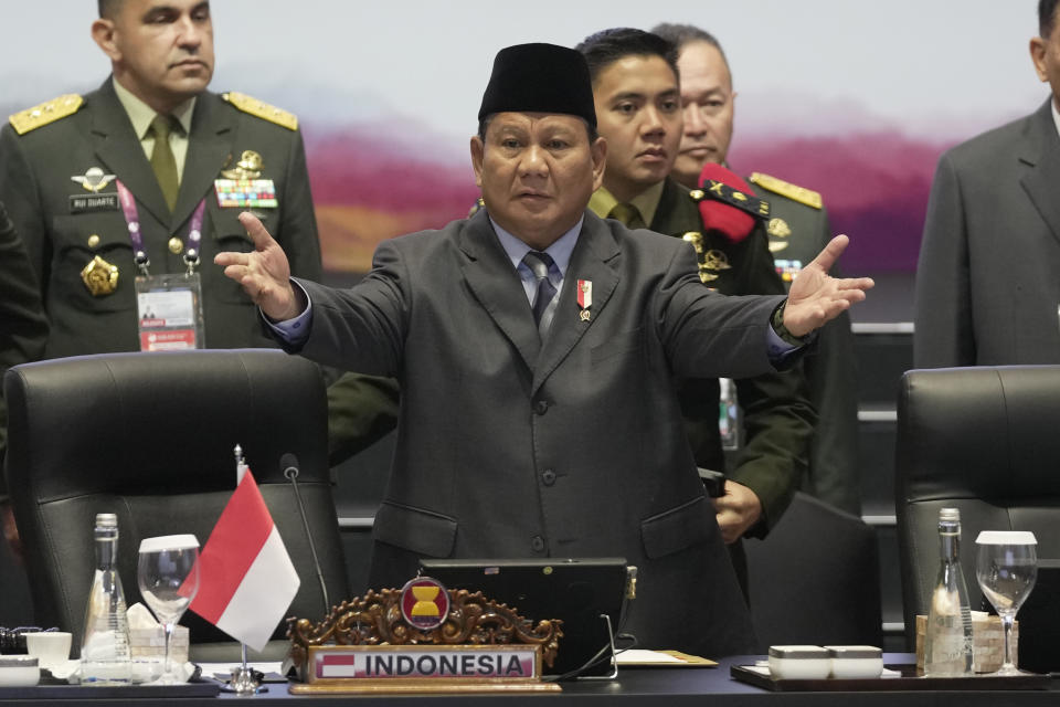 Indonesia's Defense Minister Prabowo Subianto, center, gestures at ministers and delegate members to take their seats during the opening session of the Association of Southeast Asian Nations (ASEAN) Defense Ministers Meeting in Jakarta, Indonesia, Wednesday, Nov. 15, 2023. (AP Photo/Dita Alangkara, Pool)