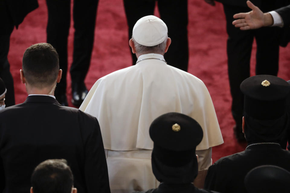 Pope Francis arrives at the Sayidat al-Nejat (Our Lady of Salvation) Cathedral, in Baghdad, Iraq, Friday, March 5, 2021. Pope Francis has arrived in Iraq to urge the country's dwindling number of Christians to stay put and help rebuild the country after years of war and persecution, brushing aside the coronavirus pandemic and security concerns. (AP Photo/Andrew Medichini)