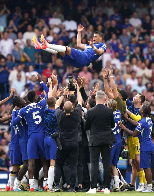 Chelsea’s Thiago Silva (centre) is lifted up into the air by his team-mates after the final whistle