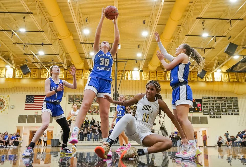 Eastern Hancock forward Ruby White (30) reaches for the ball against Lapel Bulldogs Laniah Wills (11) on Tuesday, Dec. 12, 2023, during the game at Lapel High School in Lapel. Eastern Hancock defeated the Lapel Bulldogs, 62-55.