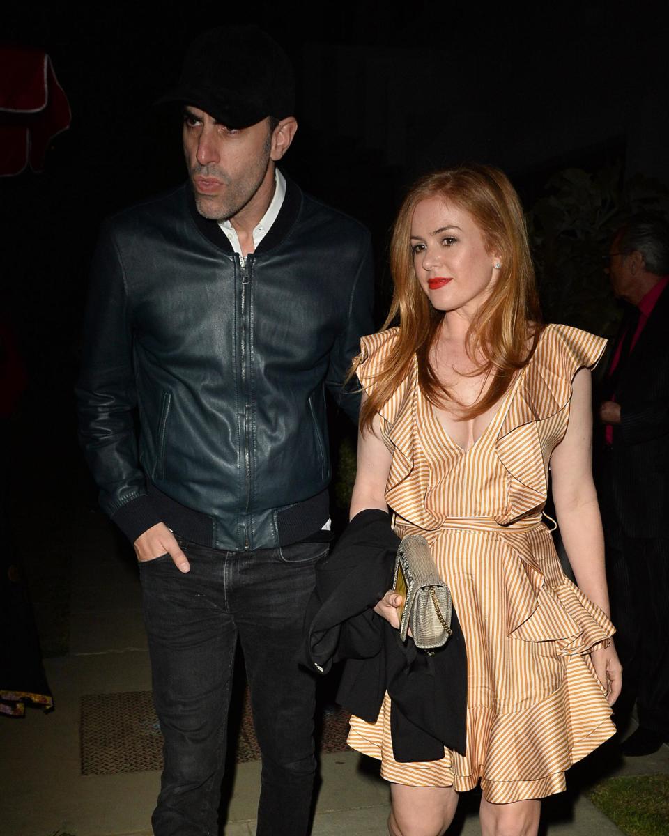 Isla Fisher and Sacha Baron Cohen Attends Elton Johns 70th Birthday Party