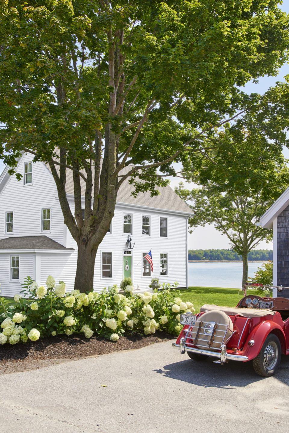 <p>Use a bed of blooms to separate the driveway pavement from the grass, as designer Loi Thai did with this Maine fixer-upper. </p><p><strong><a href="https://www.countryliving.com/gardening/garden-ideas/g29816826/garden-edging-ideas/" rel="nofollow noopener" target="_blank" data-ylk="slk:Read more garden edging ideas;elm:context_link;itc:0;sec:content-canvas" class="link ">Read more garden edging ideas</a>.</strong></p><p><a class="link " href="https://www.amazon.com/s?k=flower+food&i=lawngarden&ref=nb_sb_noss_2&tag=syn-yahoo-20&ascsubtag=%5Bartid%7C10050.g.1432%5Bsrc%7Cyahoo-us" rel="nofollow noopener" target="_blank" data-ylk="slk:SHOP FLOWER FOOD;elm:context_link;itc:0;sec:content-canvas">SHOP FLOWER FOOD</a></p>