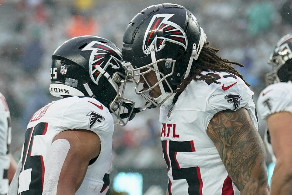 Atlanta Falcons tight end MyCole Pruitt (85) celebrates with Atlanta Falcons running back Tyler Allgeier (25) after scoring a touchdown against the New York Jets during the second quarter of an NFL football game, Sunday, Dec. 3, 2023, in East Rutherford, N.J. (AP Photo/Seth Wenig)