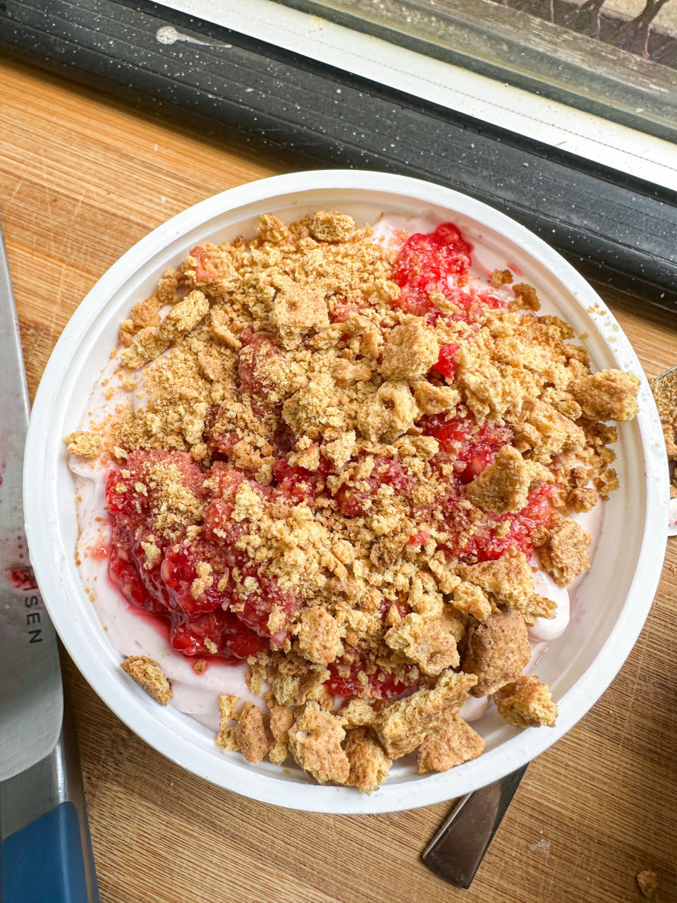 cottage cheese mixture topped with the raspberry mash and graham cracker bits