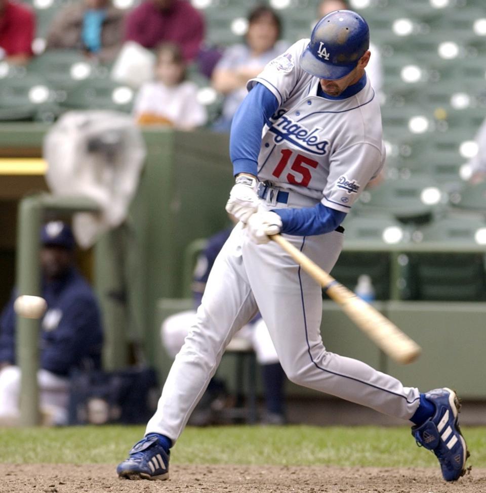 Los Angeles Dodgers' Shawn Green hits his fourth home run of the game against the Milwaukee Brewers in the ninth inning Thursday May 23, 2002, in Milwaukee. Green tied a major league record with four homer runs in the Los Angeles Dodgers' 16-2 victory over the Milwaukee Brewers.