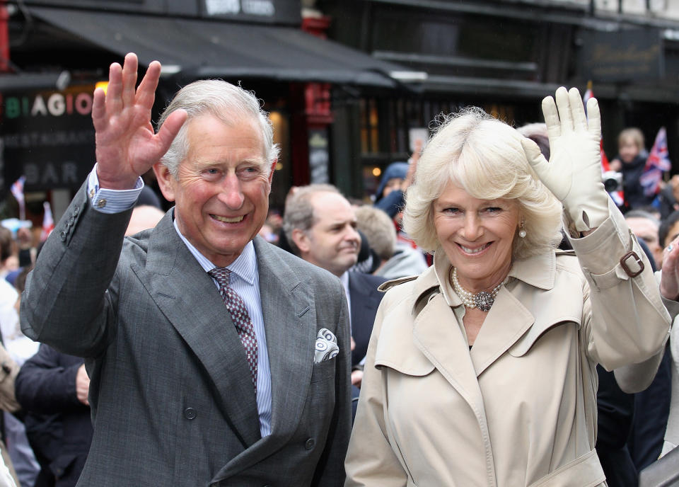 LONDON, ENGLAND - JUNE 03: Prince Charles, Prince of Wales and Camilla, Duchess of Cornwall attend the 'Big Jubilee Lunch' in Piccadilly ahead of the Diamond Jubilee River Pageant on June 3, 2012 in London, England. For only the second time in its history the UK celebrates the Diamond Jubilee of a monarch. Her Majesty Queen Elizabeth II celebrates the 60th anniversary of her ascension to the throne. Thousands of well-wishers from around the world have flocked to London to witness the spectacle of the weekend's celebrations. The Queen along with all members of the royal family will participate in a River Pageant with a flotilla of a 1,000 boats accompanying them down The Thames. (Photo by Chris Jackson - WPA Pool /Getty Images)