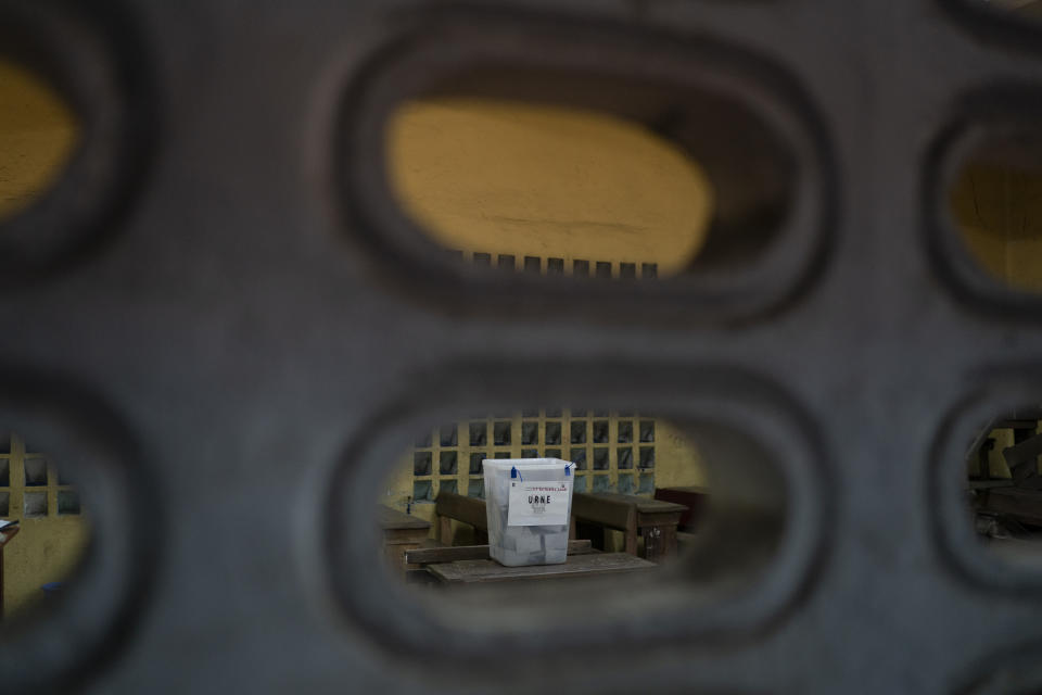 A ballot box is seen at a polling station before being open during presidential elections in Abidjan, Ivory Coast, Saturday, Oct. 31, 2020. Some tens of thousands of security forces have been deployed across the Ivory Coast on Saturday as the leading opposition parties boycotted the election, calling President Ouattara's bid for a third term illegal. (AP Photo/Leo Correa)